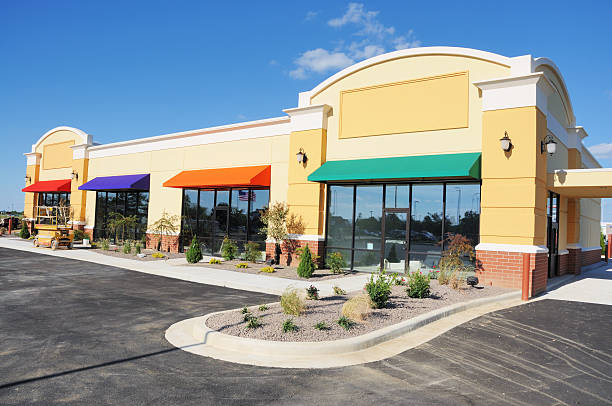 Office building exterior with vibrant awnings and clean stucco walls completed by a commercial painter in Beverly Hills, CA.