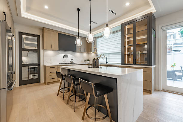 Open kitchen with warm greige wall colors and crisp white ceiling trim by a painter in Los Angeles, CA.