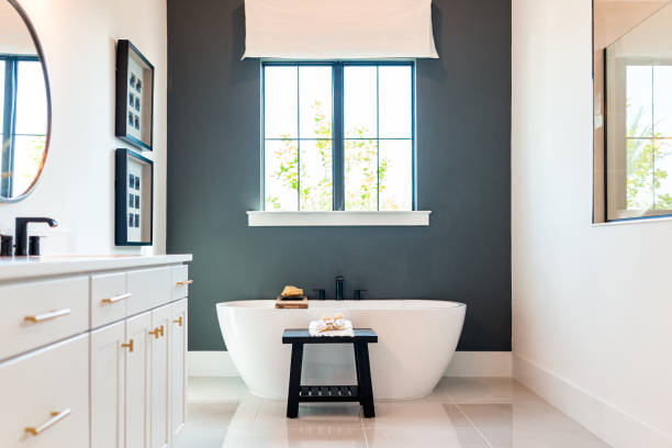 Bathroom with dark blue-gray accent wall and contrasting trim by a house painter in Mission Viejo, CA