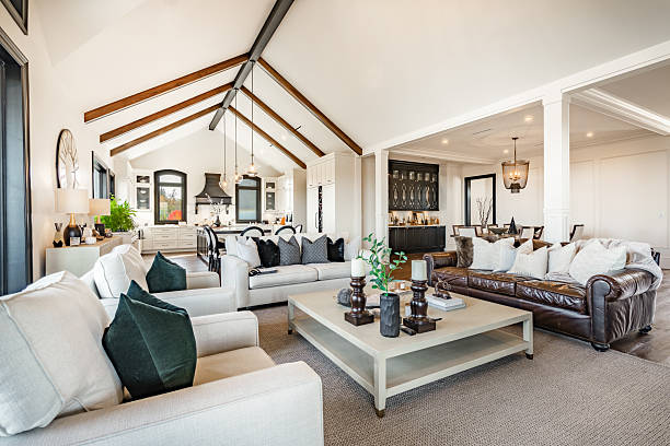 Living room with neutral wall colors, crisp white trim, and complementary paint finishes by an interior painter in Irvine, CA.